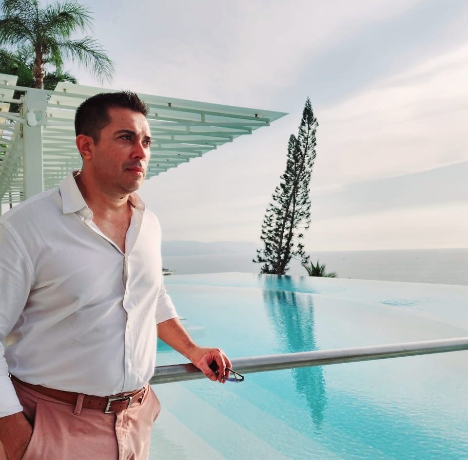 about visit vallarta rentals humberto fuentes standing by the pool